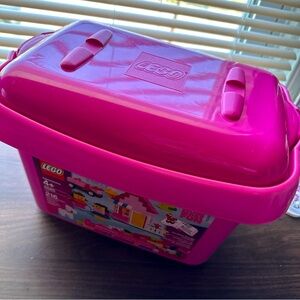 Sturdy pink Lego tub, with random Legos.